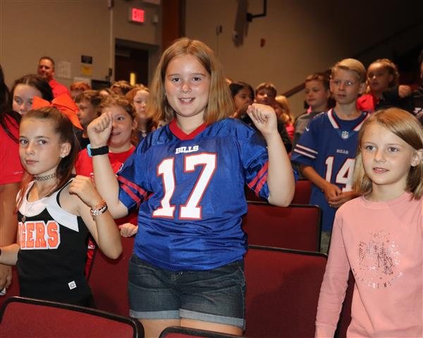 Student participating in assembly