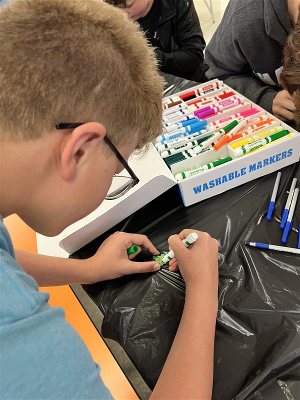 Student coloring puzzle piece
