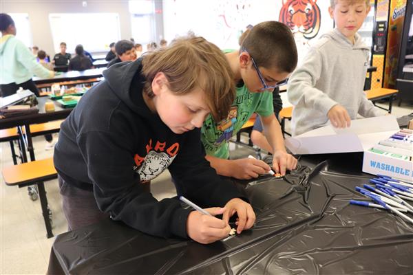 Student coloring puzzle piece