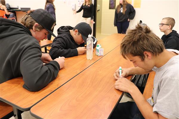 Students coloring their puzzle pieces
