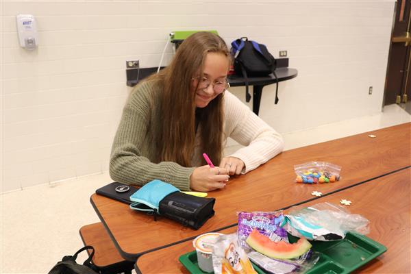 Student coloring her puzzle piece