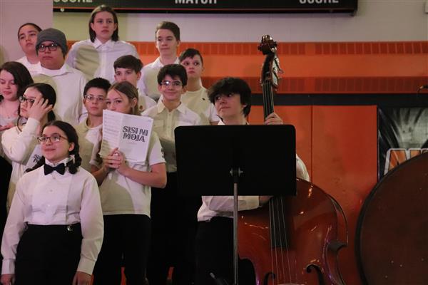 Bass player accompanies MS chorus