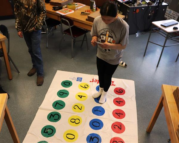 Student using game board
