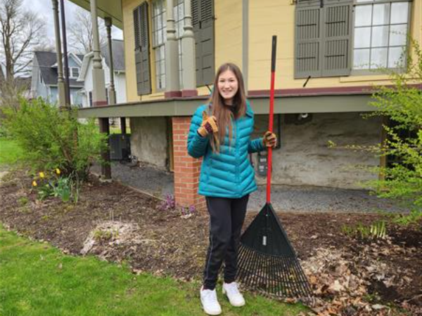 Sarah with a rake