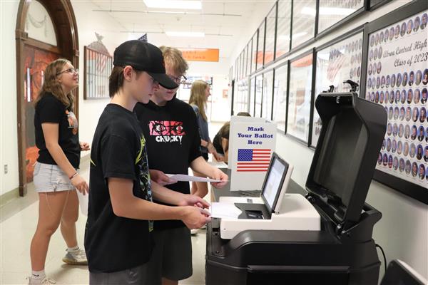 Students submit their ballot