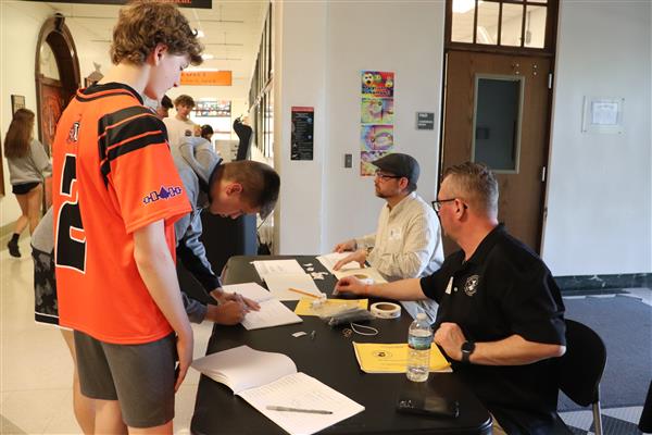 Students sign for ballot