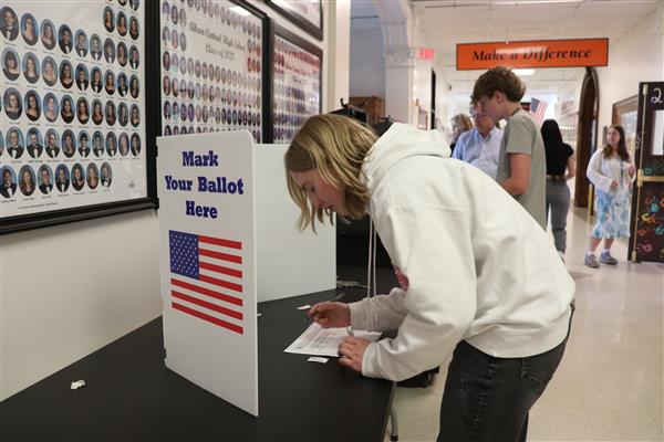 Student marking her ballot