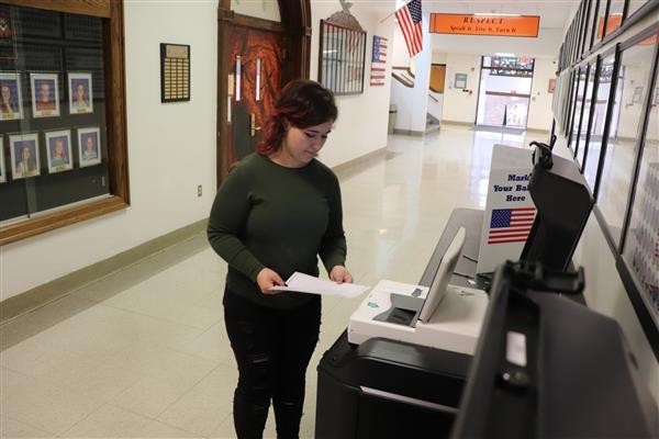 Student submitting ballot