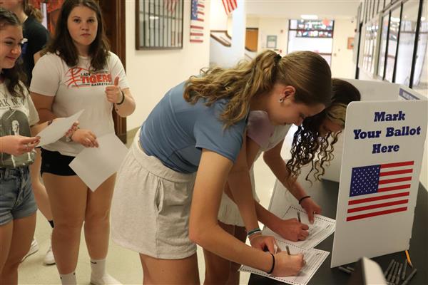Students marking their ballots