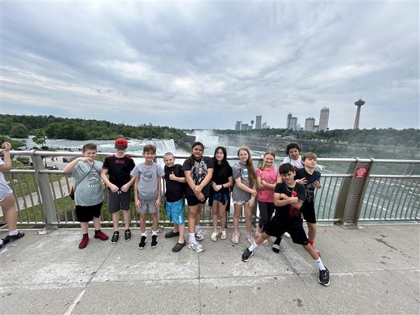 Small group photo with falls in background