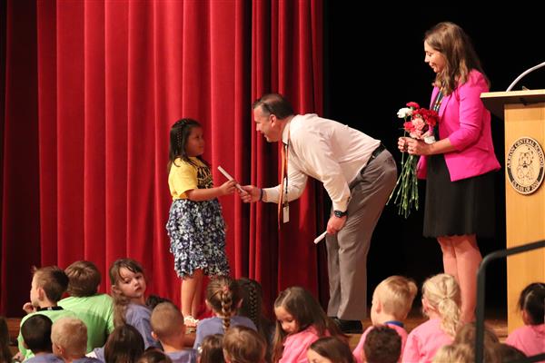 Principals giving certificate