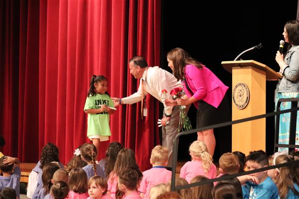 Principals giving certificate
