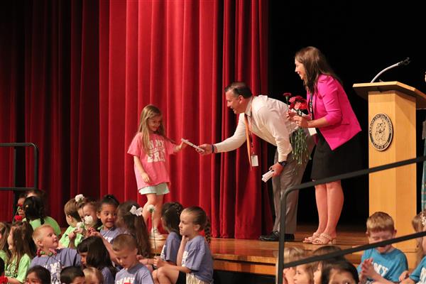 Principals giving certificate