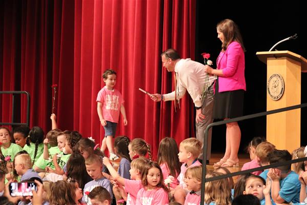 Principals giving certificate