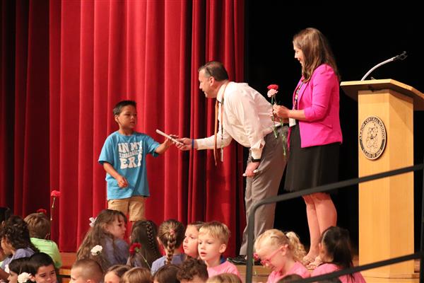 Principals giving certificate