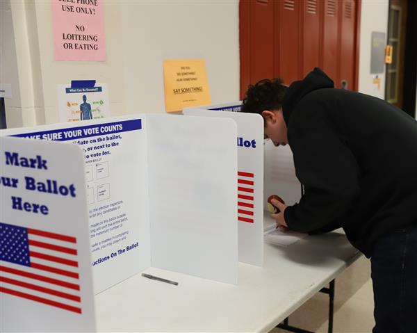 student completing ballot
