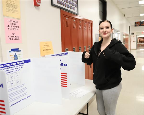 student completing ballot
