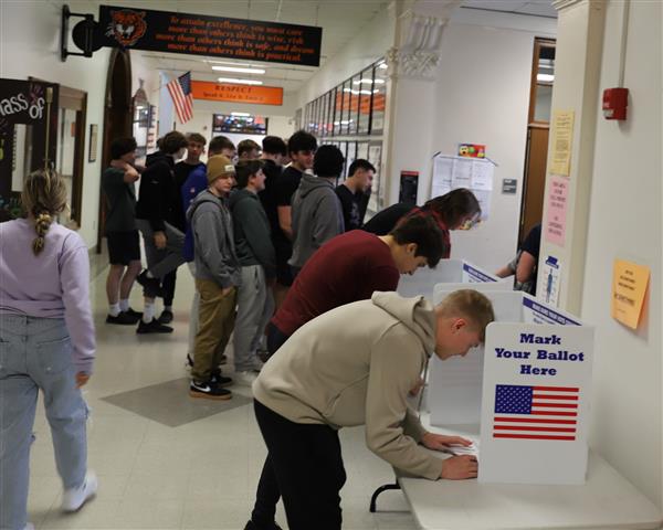 student completing ballot