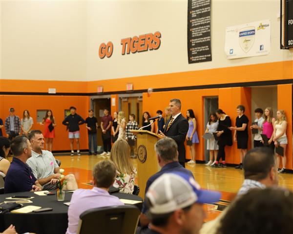 Mr. Caprio with students in background