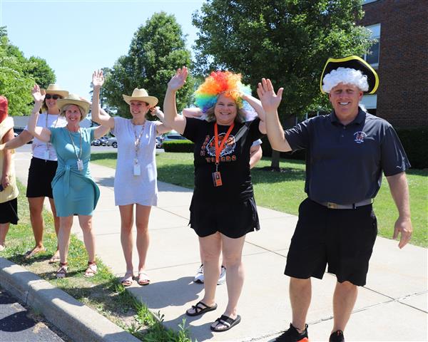 teachers waving