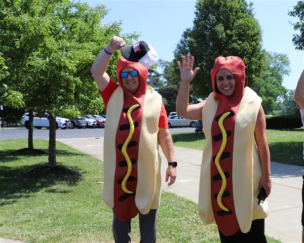 Principals in hot dog costumes