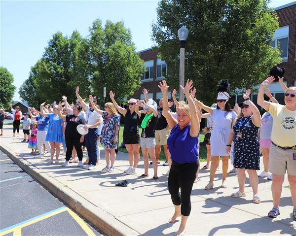 teachers waving