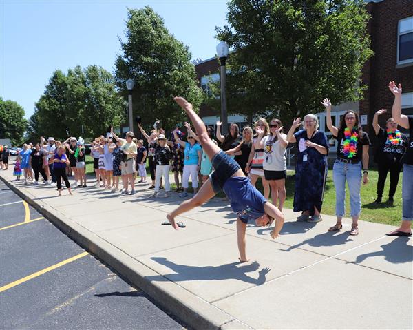 teachers waving