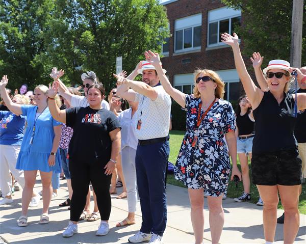teachers waving