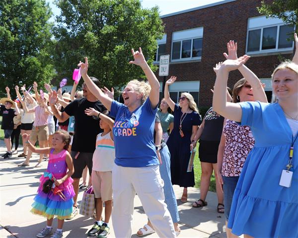 teachers waving