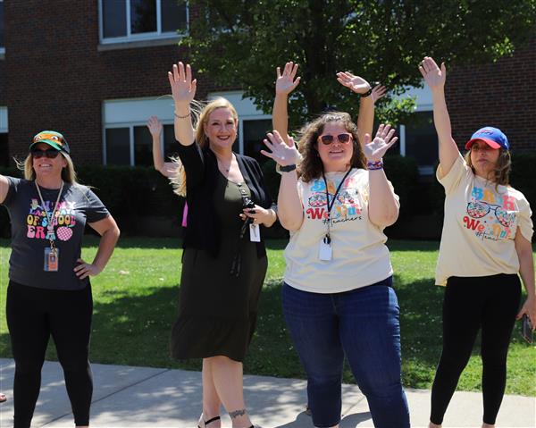 teachers waving
